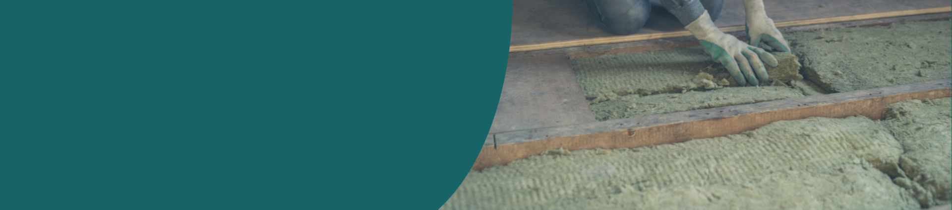 Image of a man removing old loft insulation