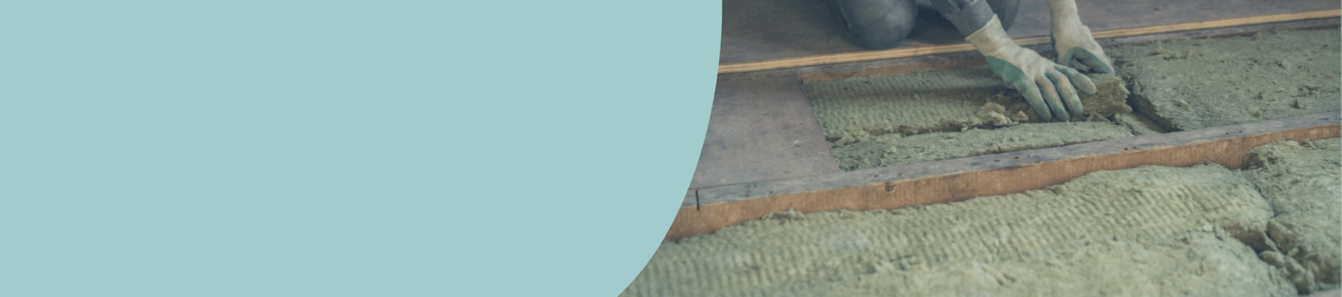 Image of a man removing old loft insulation