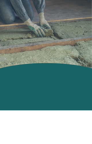 Image of a man removing old loft insulation